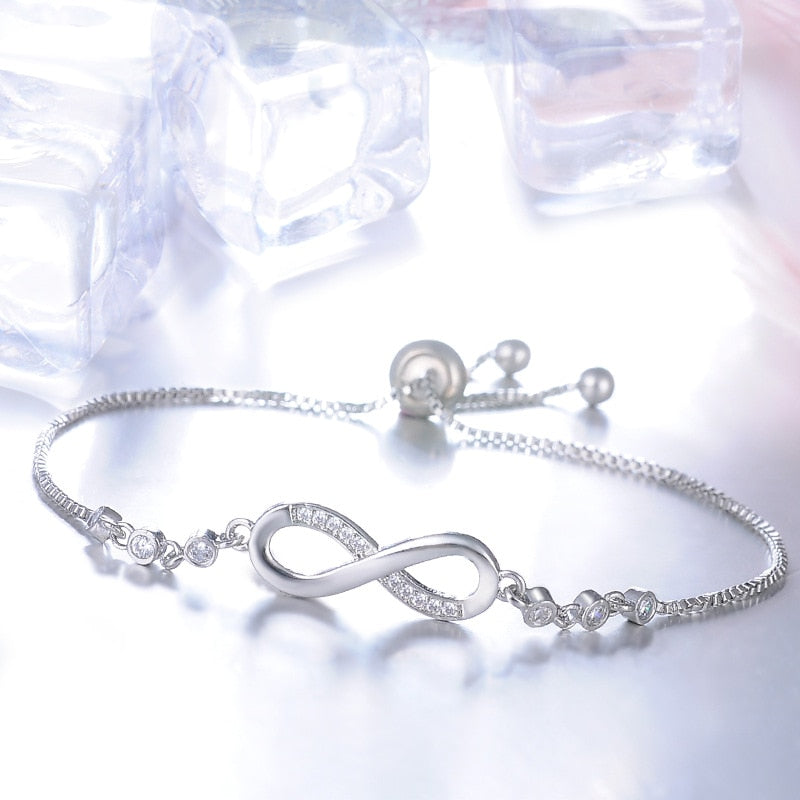 Pulsera Infinity con Diamantes — Oro y Plata